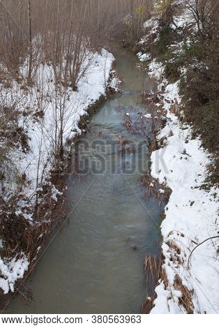 Gallego River with its snow-covered banks. Sabinanigo. Huesca. Aragon. Spain.