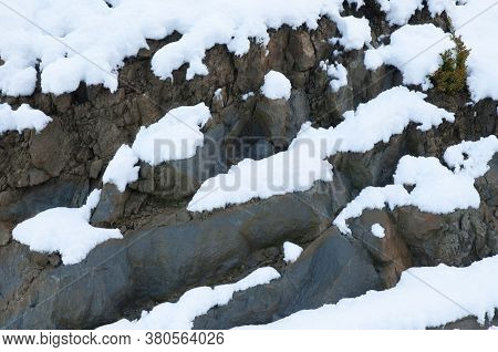 Rocky cliff covered with snow. Sabinanigo. Huesca. Aragon. Spain.