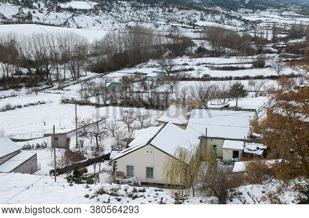 Houses and rural landscape covered with snow. Sabinanigo Alto. Huesca. Aragon. Spain.