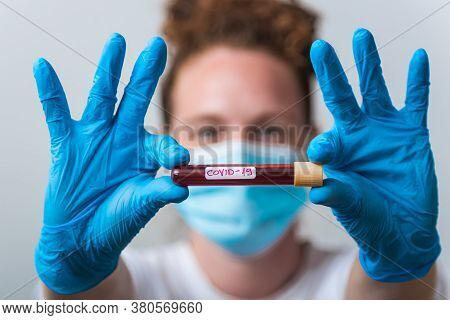 Tube Of Blood And Blood Serum In The Hands Of The Scientist Or Laboratory For Analysis And Research 