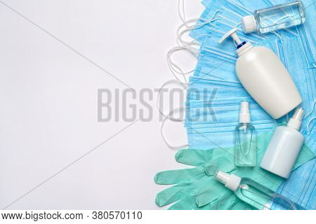 Flat Layout Of Hygiene Items - Latex Gloves, Mask And Hand Sanitizer Or Liquid Soap Isolated On Whit