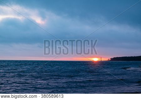 Amazingly Beautiful Winter Sea Coast At Sunset, Curved Coast Line With Forest In The Background, Bea