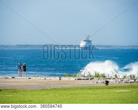Benoa, Bali / Indonesia - 10/30/2017 Tourists Viewing The Waves Hitting The Reef In Benoa Bay