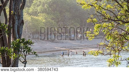 Nusa Dua, Bali / Indonesia - 10/30/2017 Tourists And Locals Enjoying The Beach At Nusa Dua