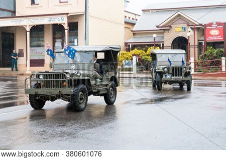 Charters Towers, Australia - April 25, 2019: Returned Soldiers Driving Old Army Jeeps In Anzac Day P