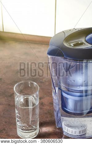 Water Filter Jug With Shungite Cartridge Inside On The Kitchen Counter. Shungite Cartridge For Clean