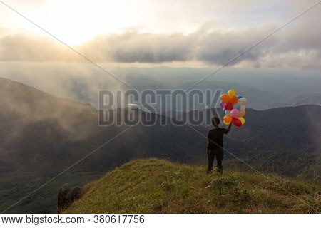 Man With A Balloon Along With The Evening View Doi Mon Chong Area, Chiang Mai.