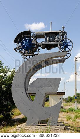 The First Soviet Tractor Of The Twentieth Century. A Monument Of History On The Soviet Symbolism Ham