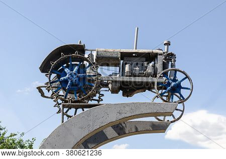 The First Soviet Tractor Of The Twentieth Century. A Monument Of History On The Soviet Symbolism Ham