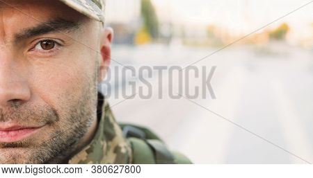 Portrait Of Caucasian Handsome Young Man Soldier In Cap With Backpack Looking Confident At Street. C