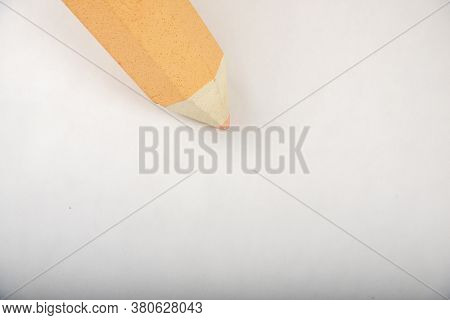 Orange Pen Stands On A White Background.