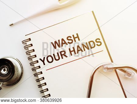 Stethoskope With Notebook With Text Wash Your Hands On White Background. Hygiene Concept