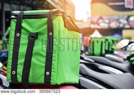 The Green Bag On The Motorcycle Of The Food Delivery Staff Waits To Put Food In Order To Deliver To 