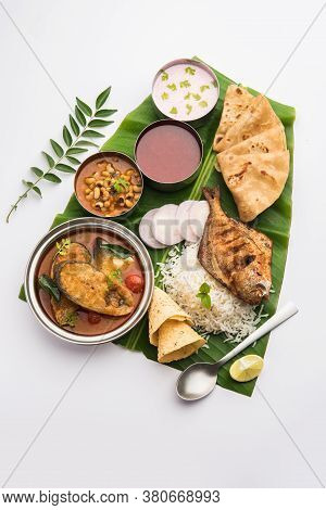 Indian Fish Platter Or Seafood Thali Served In A Steel Plate Or Over Banana Leaf