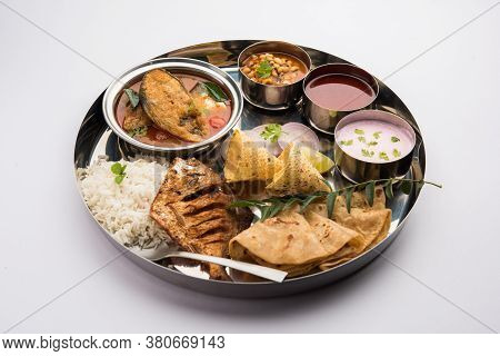 Indian Fish Platter Or Seafood Thali Served In A Steel Plate Or Over Banana Leaf