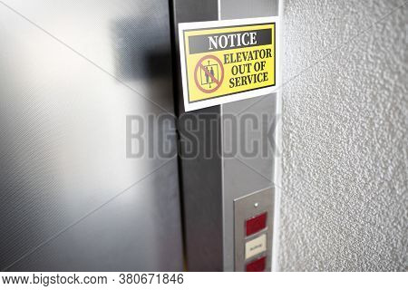 Yellow Elevator Out Of Service Notice Sign Attached To Elevator Door, Digital Composite