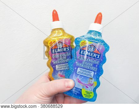 Moscow, Russia, December 2019: Close-up Of Bottles With Elmers Golden And Blue Glitter Glue For Maki