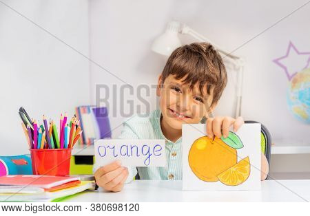 Smiling Boy In Development Class With Word And Object Card During Aba Therapy