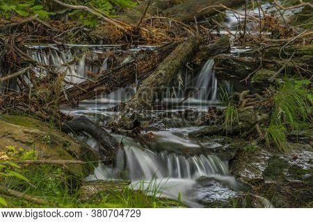 Small Waterfall On Divoky Creek Near Kouty Nad Desnou Village In Summer Day