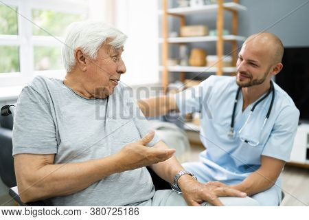 Senior Healthcare Caregiver And Happy Elder Patient