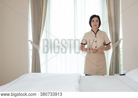 Young Asia Chambermaid In The Hotel Room Her Lool At Camera
