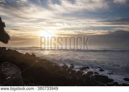 Ocean Waves Breaking On The Rocky Beach