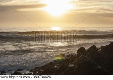 Ocean Waves Breaking On The Rocky Beach