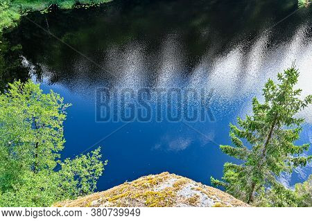 Overlooking A Little Lake From A Mountain In Sweden