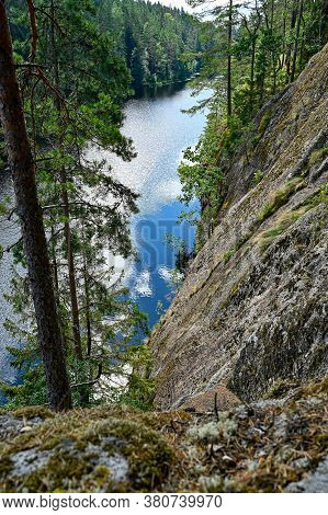 Overlooking A Little Lake From A Mountain In Sweden