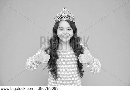 Promoting Your Content. Happy Child Give Thumbs Ups Blue Background. Princess Girl Wear Crown. Promo