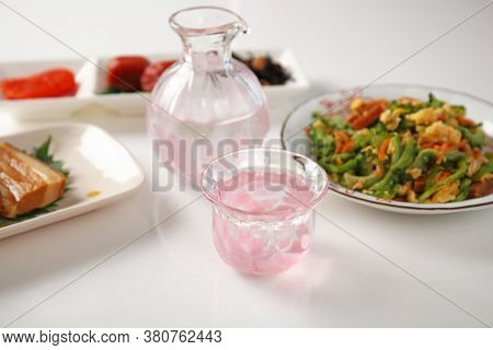 Delicious Japanese Traditional Foods And Sake Isolated On White Background.
