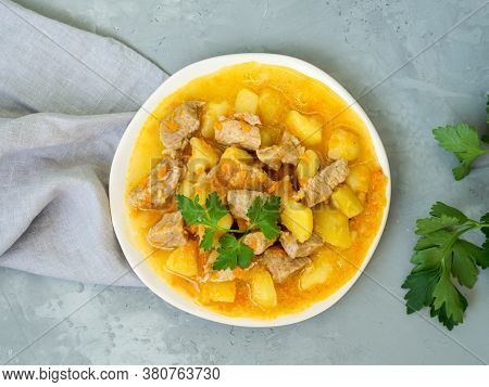 Romanian Cuisine - Fresh Homemade Meat And Potatoes With Parsley. Stew With Pork And Vegetables On A