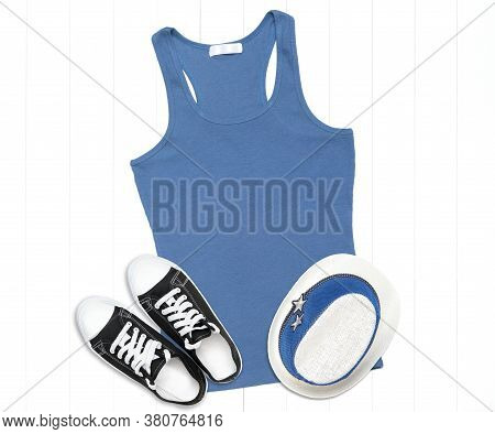 Tank Top In Iris Color With Sneakers And A Summer Hat On A Light Wooden Background - Tank Top Mockup