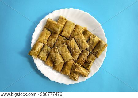Traditional Turkish, Arabic, Middle Eastern Baklava. Top View. Arabic Baked Sweets In White Plate On