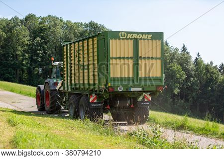 Bavaria/ Germany - August 07,2020: Fendt Favorit 926 Vario Tractor Drives With A Krone Zx400gl Trail
