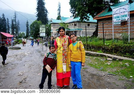 Manali, Himachal Pradesh, India, 27 June 2017: Two Indian Boys With Their Mother And Granny Standing