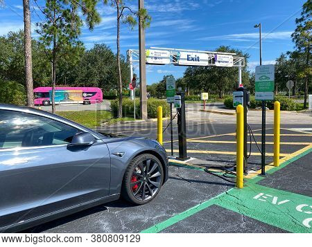 Orlando,fl/usa- 6/18/20: A Tesla Parked In The Ev Parking Spot In The Parking Lot At Seaworld In Orl