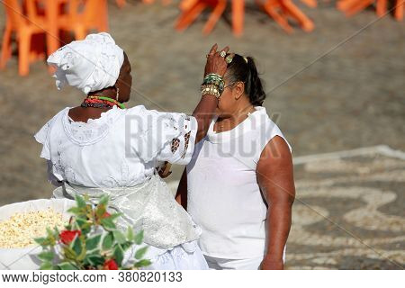 Salvador, Bahia / Brazil - January 25, 2015: Candomble Fans Are Seen During A Bath With Popcorn In T