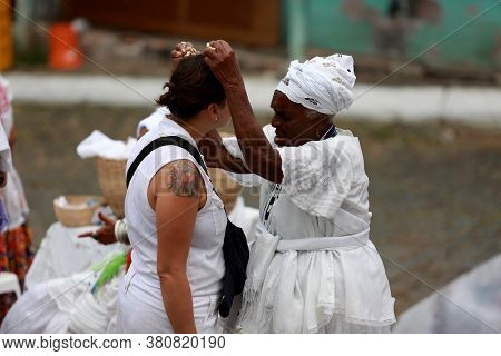 Salvador, Bahia / Brazil - January 25, 2015: Candomble Fans Are Seen During A Bath With Popcorn In T