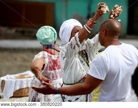 Salvador, Bahia / Brazil - January 25, 2015: Candomble Fans Are Seen During A Bath With Popcorn In T