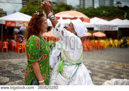 Salvador, Bahia / Brazil - January 25, 2015: Candomble Fans Are Seen During A Bath With Popcorn In T