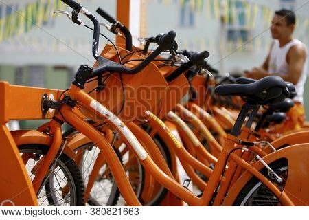Salvador, Bahia / Brazil - August 22, 2014: Users Of The Salvador Vai De Bike Project Remove A Bicyc