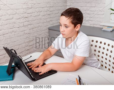 Boy Uses Digital Tablet For Video Call With His Teacher. Screen Shows Online Lecture. Explaining Sub