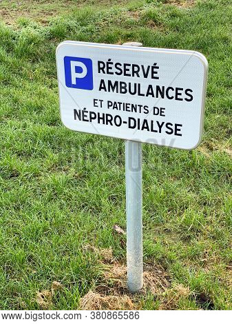 French Sign At The Hospital Translated As Reserved For Ambulances And Patient Of Nephro-dialyzed