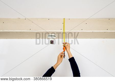 Elegant Woman Hands Female Architect Measuring With Yellow Tape The Length From The Cooker Hood Hole