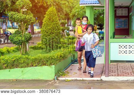 Kanchanaburi,thailand-july 2,2020:thai Students Wear Various Medical Masks To Prevent Themselves Fro