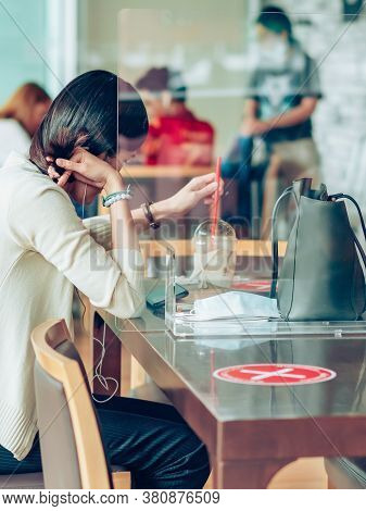Bangkok-thailand, July 14, 2020: Unidentified Customers Work On Computer With Smartphone And Relax W
