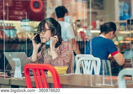 Bangkok-thailand, July 14, 2020: Unidentified Customers Work On Computer With Smartphone And Relax W
