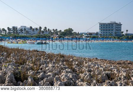 Ayia Napa, Cyprus - August 6 2020: Tropical Beach With Turquoise Water And Crowded With Tourists Swi