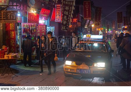 Luoyang, Henan Province / China - January 3, 2016: Lively Luoyang Old Town District At Night, With T